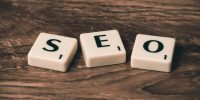pexels-photo-270637-270637 Scrabble tiles spelling 'SEO' on a wooden surface. Ideal for digital marketing themes.